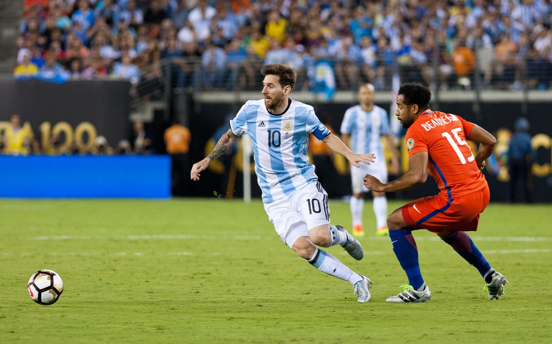 Argentina's Lionel Messi (10) maneuvers against Chile's Jean Beausejour.